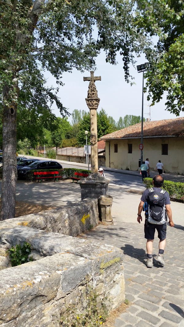 Pilgrims cross Puente de la Magdalena